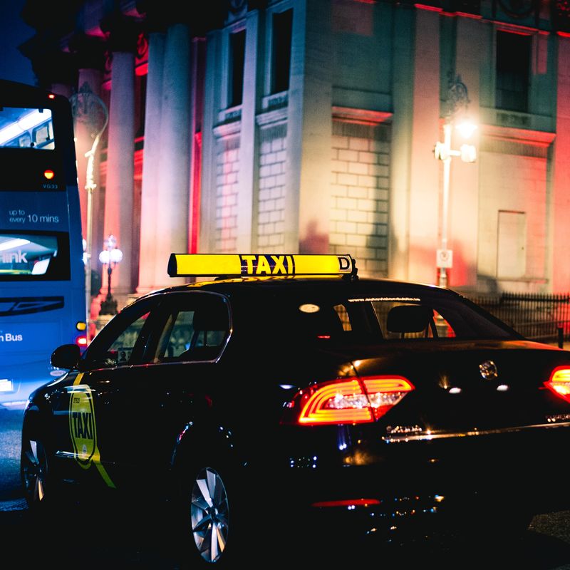 coronavirus and taxis - dublin taxi behind bus on dame street