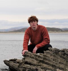 bonnerofireland.com man with red jumper posing by the sea in Donegal
