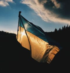 help ukraine - ukrainian flag at dusk