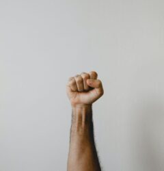 fist pointing to the sky - muse creative awards